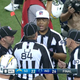 Referee Ron Torbert discusses an end-of-game call with his officiating crew. (Screenshot: CBS)